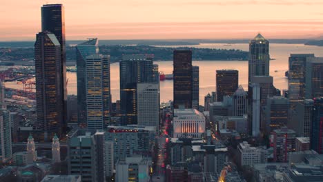 center seattle downtown architecture first hill sunset looking west towards waterfront major city streets large office building towers silhouette orange colored cloudy skies