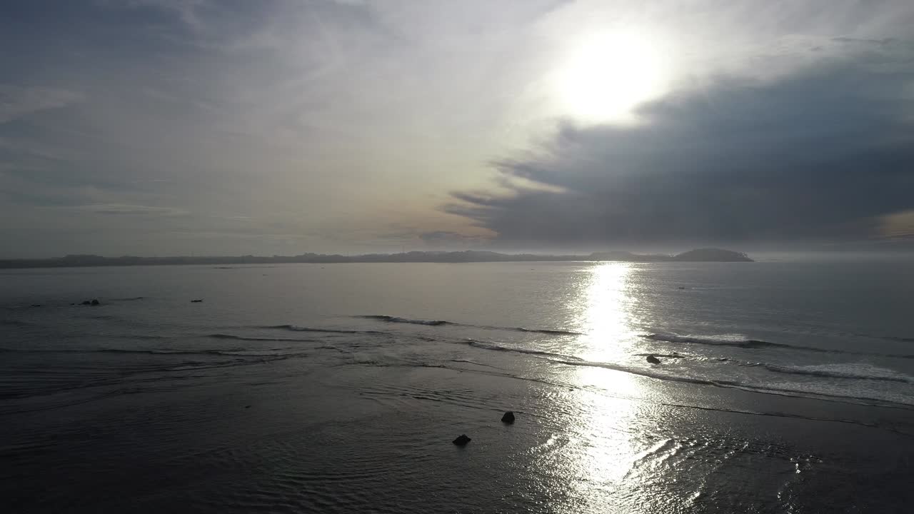 Aerial view. Aerial drone footage of ocean waves in the sunrise