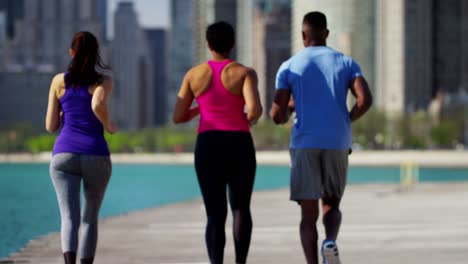 slim multi ethnic people running together for wellbeing