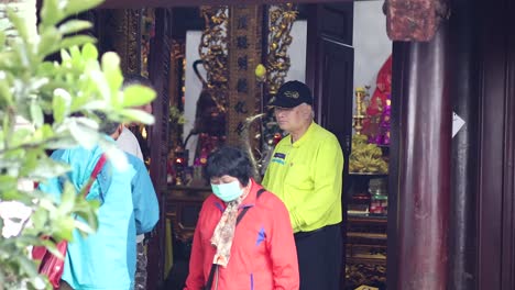 people exploring den ngoc son temple interior