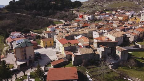 aerial view over pietraroja, an italian village on top of a hill, on a bright sunny day