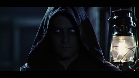 mysterious figure in dark hood