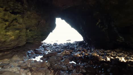 slow tracking shot through a coastal cove in south shields, revealing the peaceful shoreline