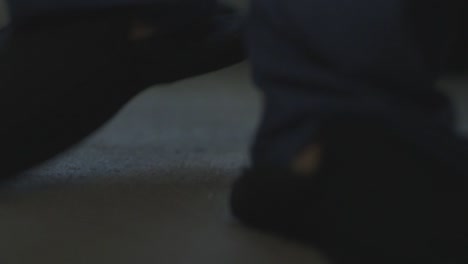 feet slipping into slippers straight out of bed close up