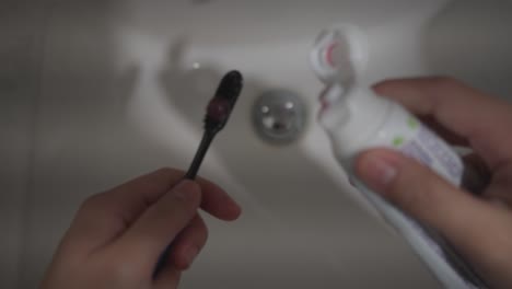 point of view of a person using toothbrush and toothpaste