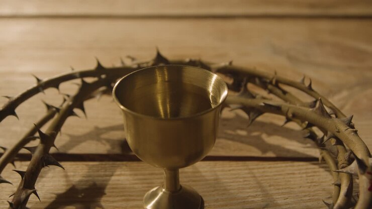 Religious Concept Shot Of Chalice With Crown Of Thorns Placed Around It On Wooden Background 1