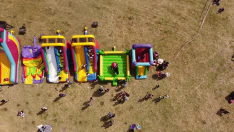 course lock shot of colored inflatable games, playground for kids out in nature