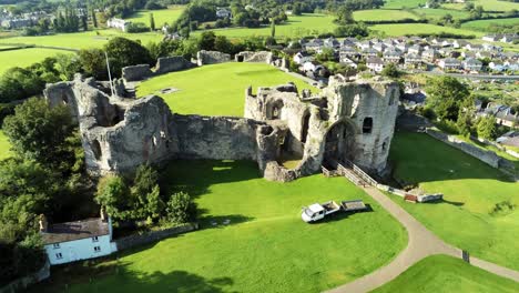 ancient british landmark denbigh castle medieval old hill monument ruin tourist attraction aerial rising forward view