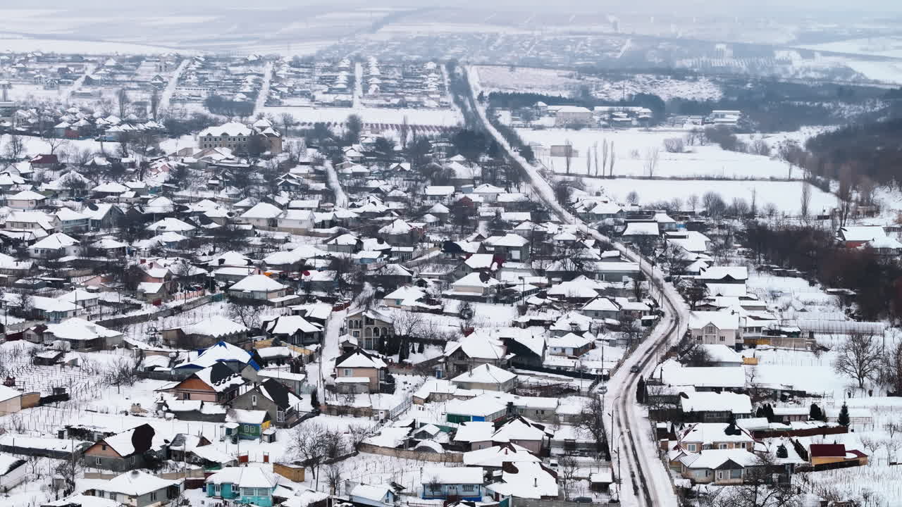 Aerial drone view of Butuceni village covered in snow. Old Orhei during winter in Moldova