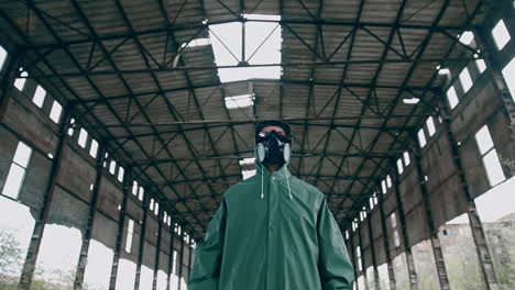 portrait of a person in gas mask in destroyed building. technogenic catastrophe. post apocalyptic world. survivor after nuclear chemical war.