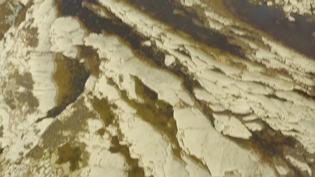 Slow-motion aerial view of summer swimmers enjoying the Pollock holes
