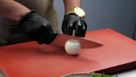 chef chopping onion for cooking