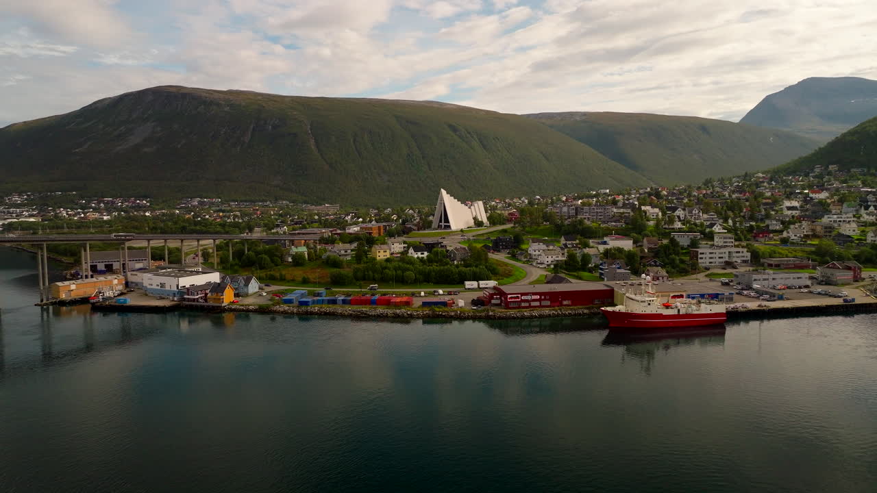 Tromso summer aerial view of Arctic Cathedral and bridge in Tromsdalen valley