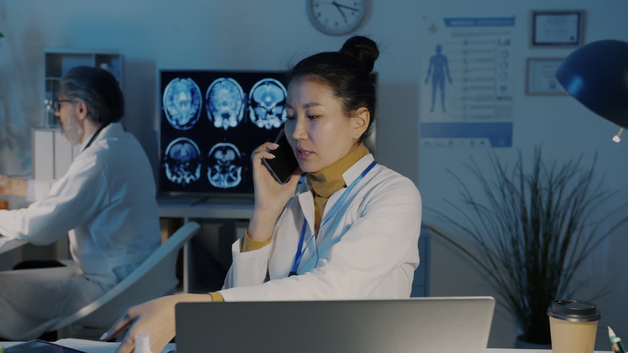 Doctor Talking on Phone in Hospital