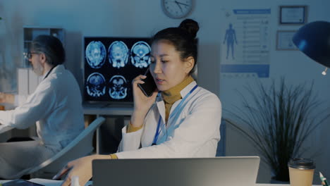 doctor talking on phone in hospital