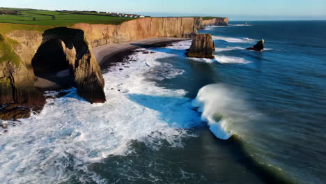 dramatic coastal scene with powerful waves and rocky formations