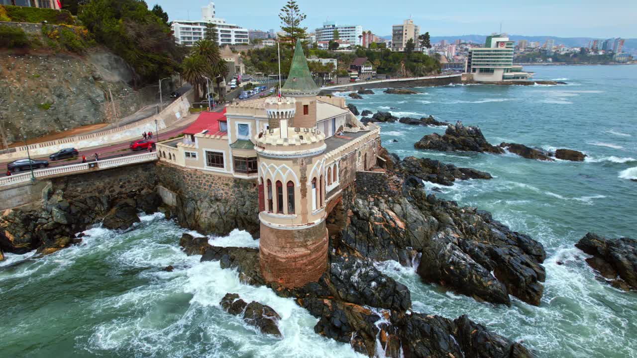 Wulff castle perched on rocky coastline in vina del mar, chile during the day, aerial view