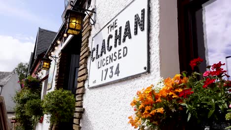 charming pub facade with vibrant floral display