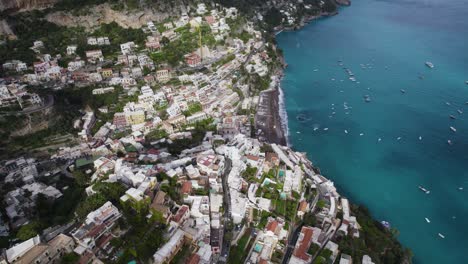 dramatic spectacular vertical aerial view of cliffside villas of positano coastal town italy