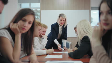 team of marketing and economy experts and female boss are meeting in conference hall