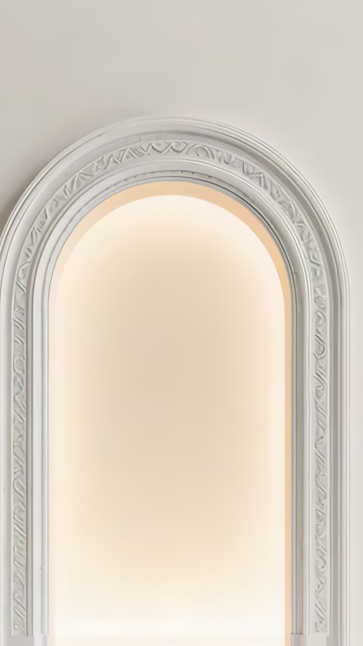 Vertical video: Glowing orb appearing in arch recess with molding on cream wall, growing into sun