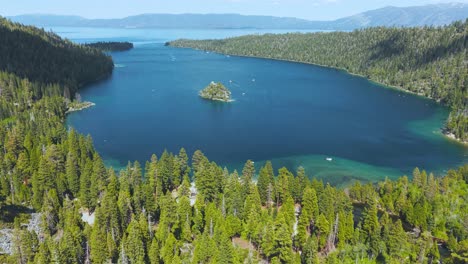emerald bay on lake tahoe, calidoenia usa, revealing drone shot of island and green forest on sunny summer day