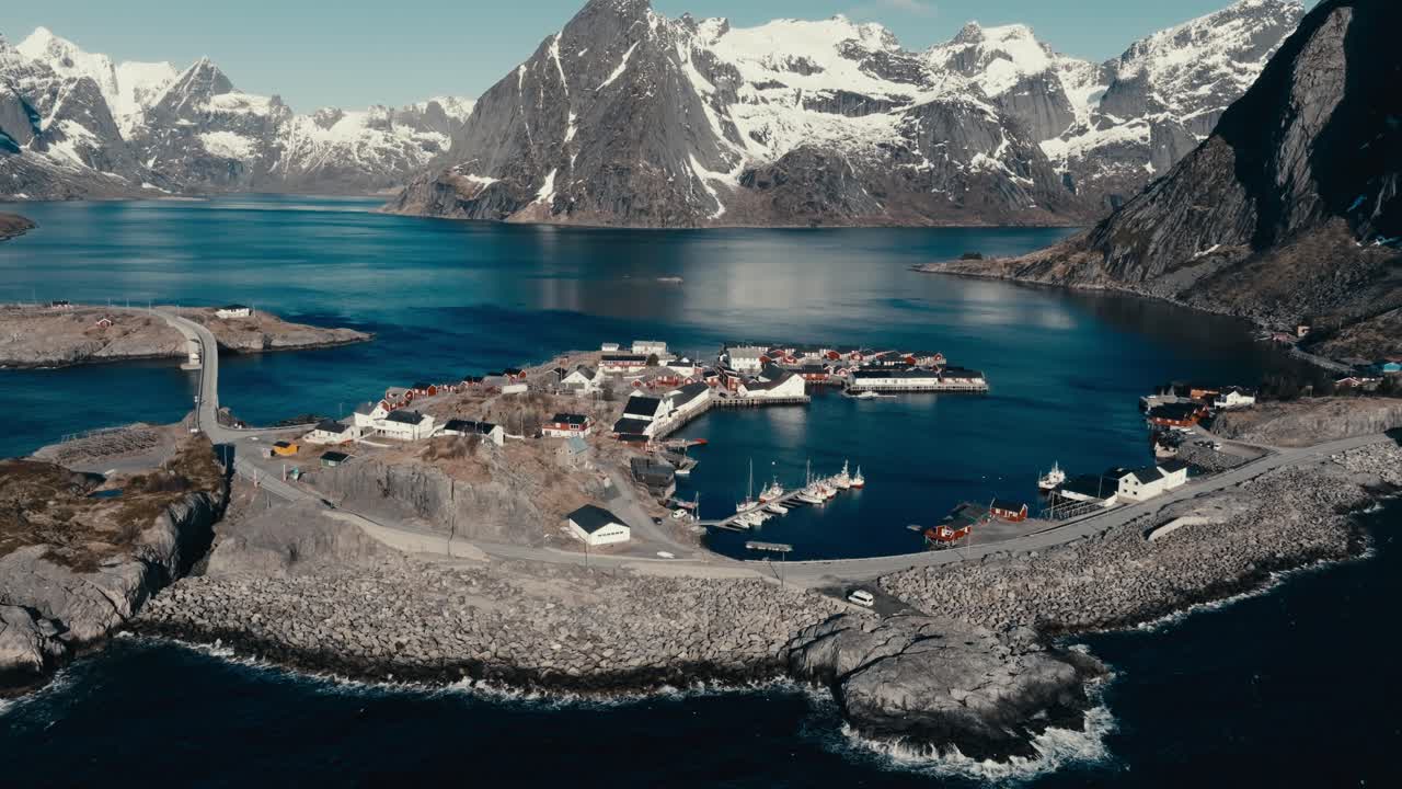 Hamnoy Island Fishing Village With Scenic Mountain Views Near Reine In Nordland, Norway. - aerial shot