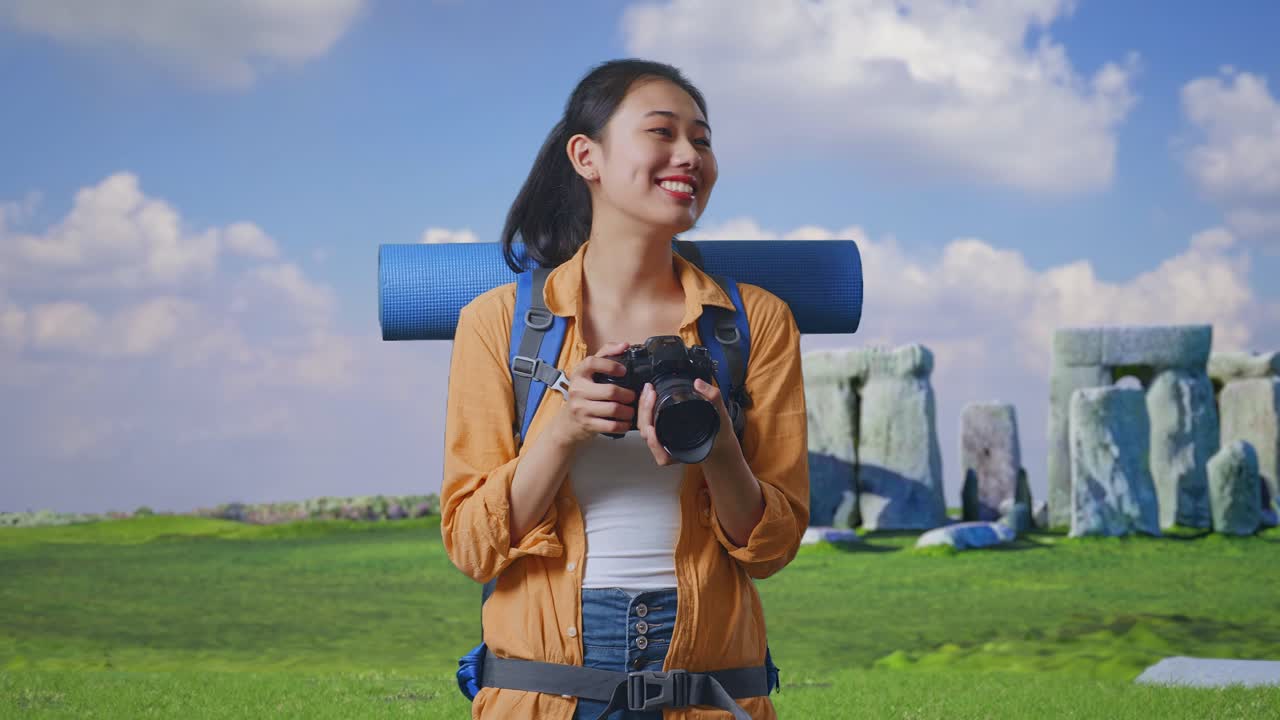 Woman Traveler with Camera at Stonehenge