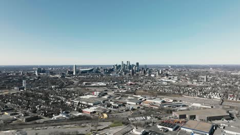 wide aerial drone shot of the downtown minneapolis skyline in minnesota