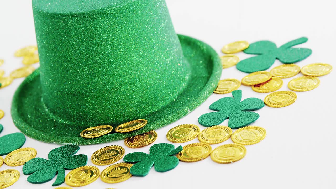 Leprechauns gold and hat with shamrocks on white background for st patricks