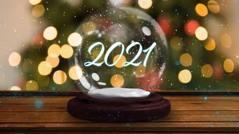 2021 en un globo de nieve