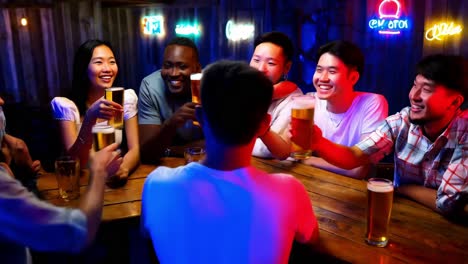 friends celebrating at a bar