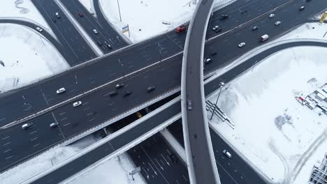 aerial view of a freeway intersection snow-covered in winter.