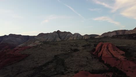 Drone-shot-flying-over-rocks-and-mountains-in-Snow-Canyon-state-park,-Utah