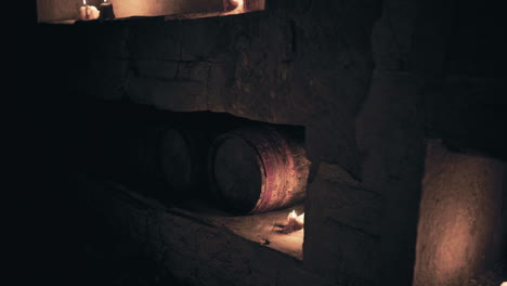 old barrels resting in a dimly lit cellar with flickering flame