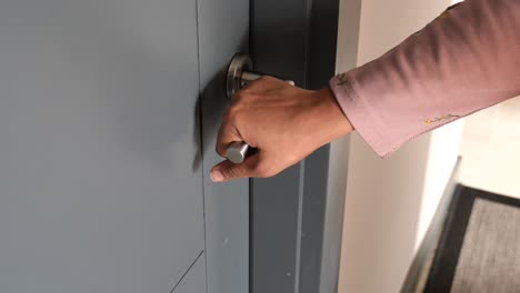 person opening a door