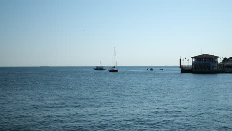 the historical moda pier and dolphins in the moda bay, istanbul