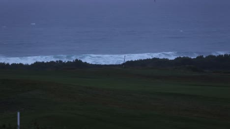 Static-shot-of-large-swells-crashing-on-Fistral-beach-during-High-tide,-Newquay