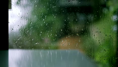 water droplets perched on the glass from the rain