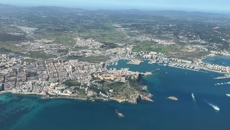 aerial view of ibiza city , from a cockpit during daylight