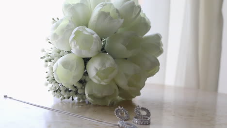 bride's bouquet and accessories on the table - push out