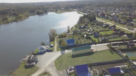 aerial view of a small village by a lake in autumn