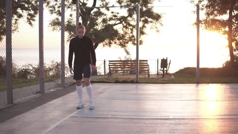 Full-Lenght-Shot-Of-Female-Basketball-Player-Doing-Legs-Dribbling-Exersice-Very-Quickly,-Training-Outdoors-On-The-Local-Court