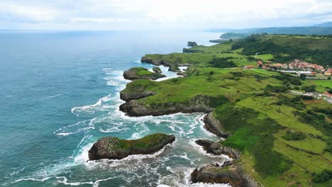 the drone is flying forward above the green coastline bilboa spain aerial footage 4k