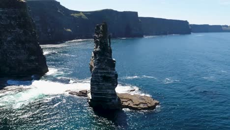 A-drone-shot-of-the-Cliffs-of-Moher,-the-tallest-sea-cliffs-of-the-rugged-West-Clare-Coast-of-Ireland