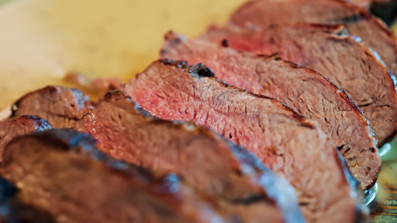Close up of a London Broil on a colourful plate at a restaurant