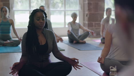 yoga class practicing meditation
