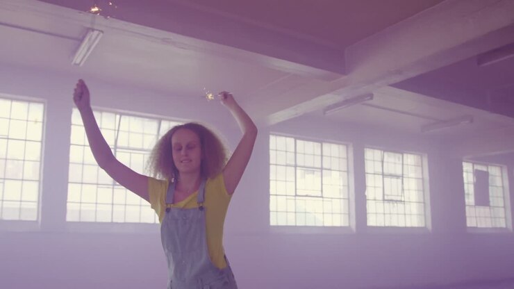 Fashionable young woman in an abandoned warehouse