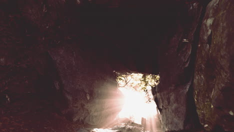 sunlight streaming through a rock arch