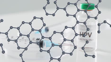 modelo de estructura molecular sobre la jeringa y el vial de vacuna contra el vph